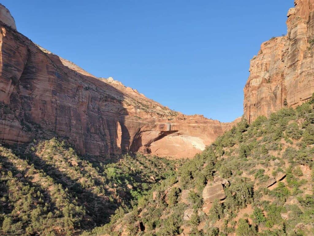 An arch forming in a canyon wall at Zion National Park.